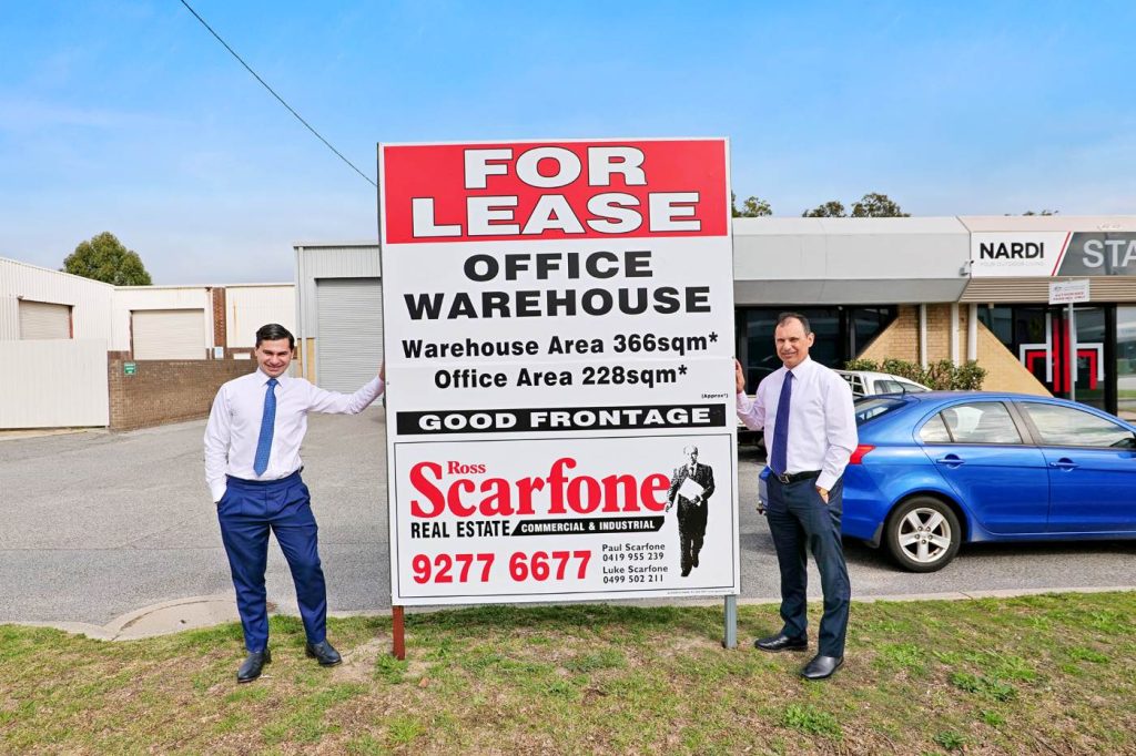 Paul and Luke with for lease sign