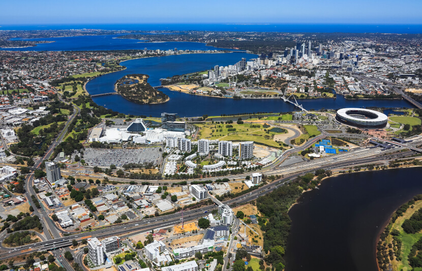 Aerial view of Optus Stadium and Burswood Peninsula featured in the 2025 commercial real estate update for the upcoming 25/26 financial year.